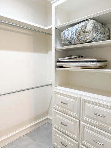 a kitchen with stainless steel appliances a stove top oven a refrigerator and a more cabinets