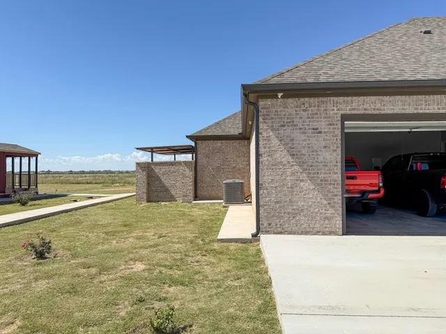 a view of a house with a sink and fire pit