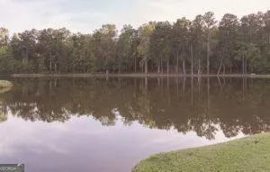 a sign that is sitting in front of flowers