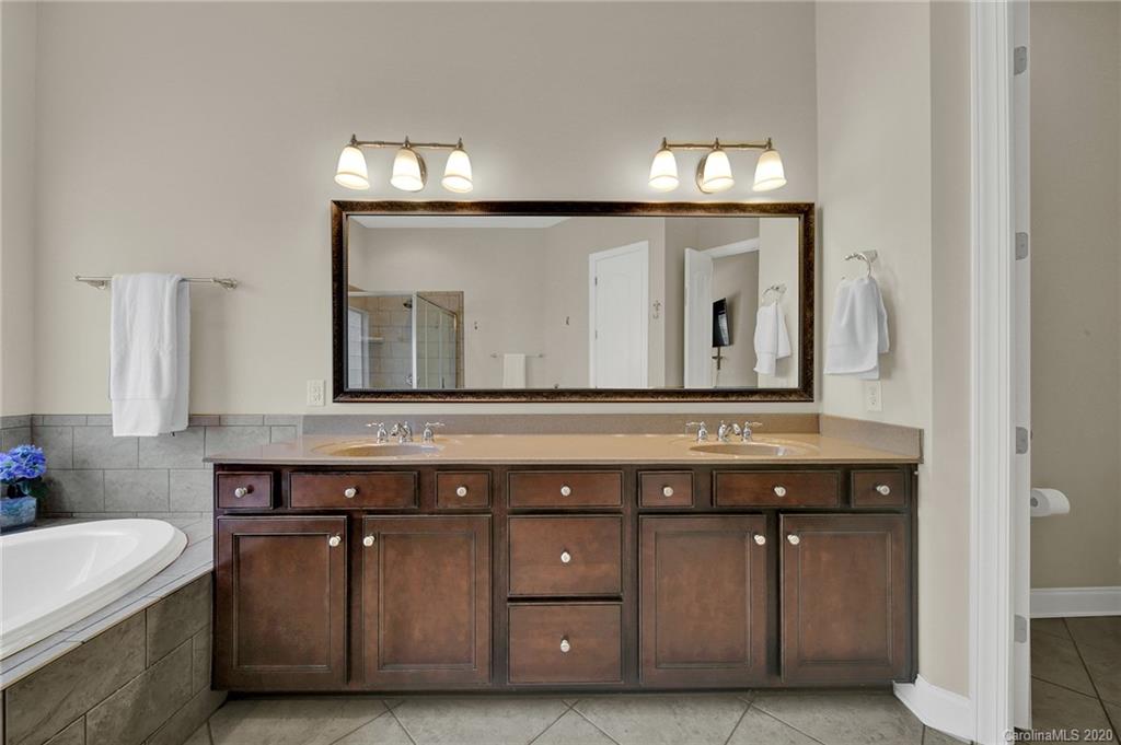 746 Quicksilver Trail Fort Mill, SC 29708 - Photo 17 of 35 a bathroom with a sink and a mirror