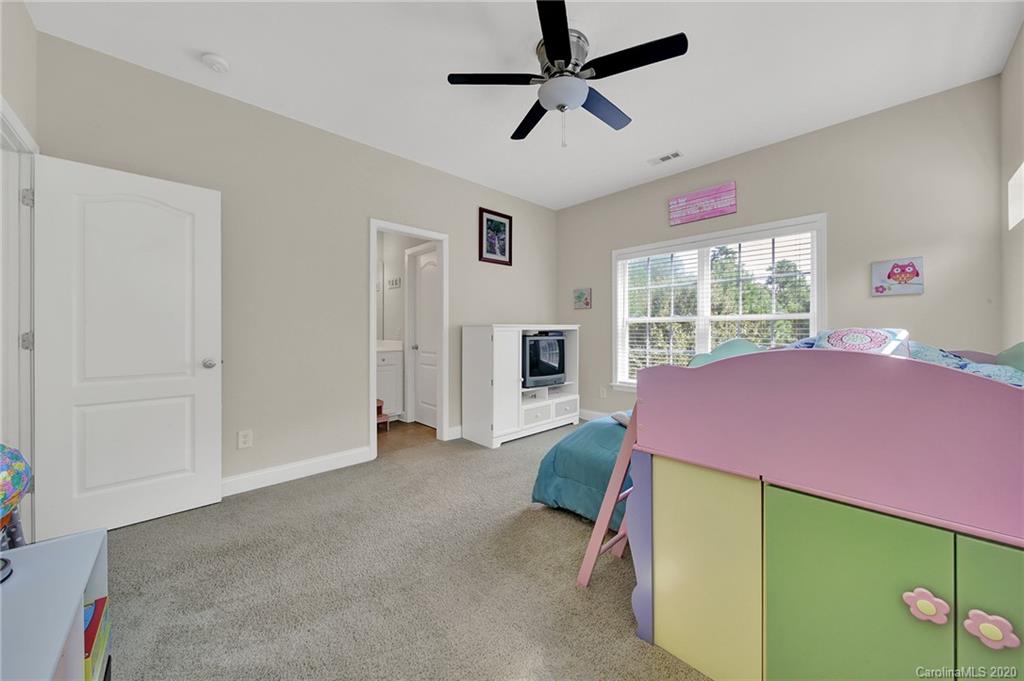 746 Quicksilver Trail Fort Mill, SC 29708 - Photo 21 of 35 a bedroom with a bed and a window