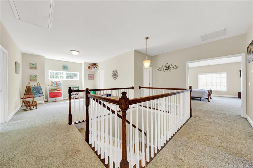 746 Quicksilver Trail Fort Mill, SC 29708 - Photo 25 of 35 a view of a livingroom with lots of furniture and windows
