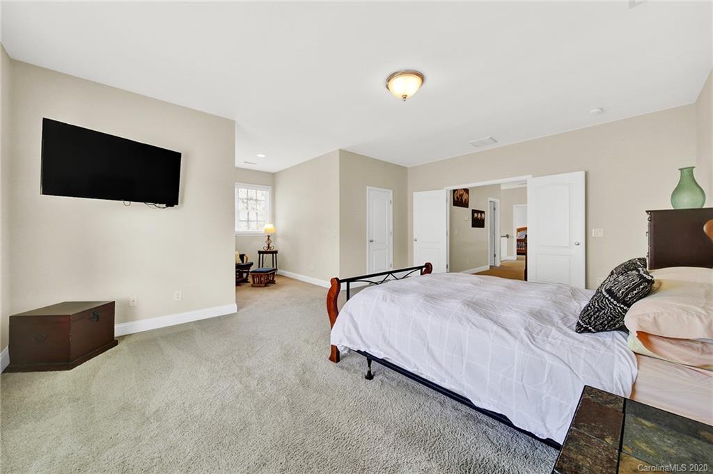 746 Quicksilver Trail Fort Mill, SC 29708 - Photo 26 of 35 a bedroom with bed tv and couch