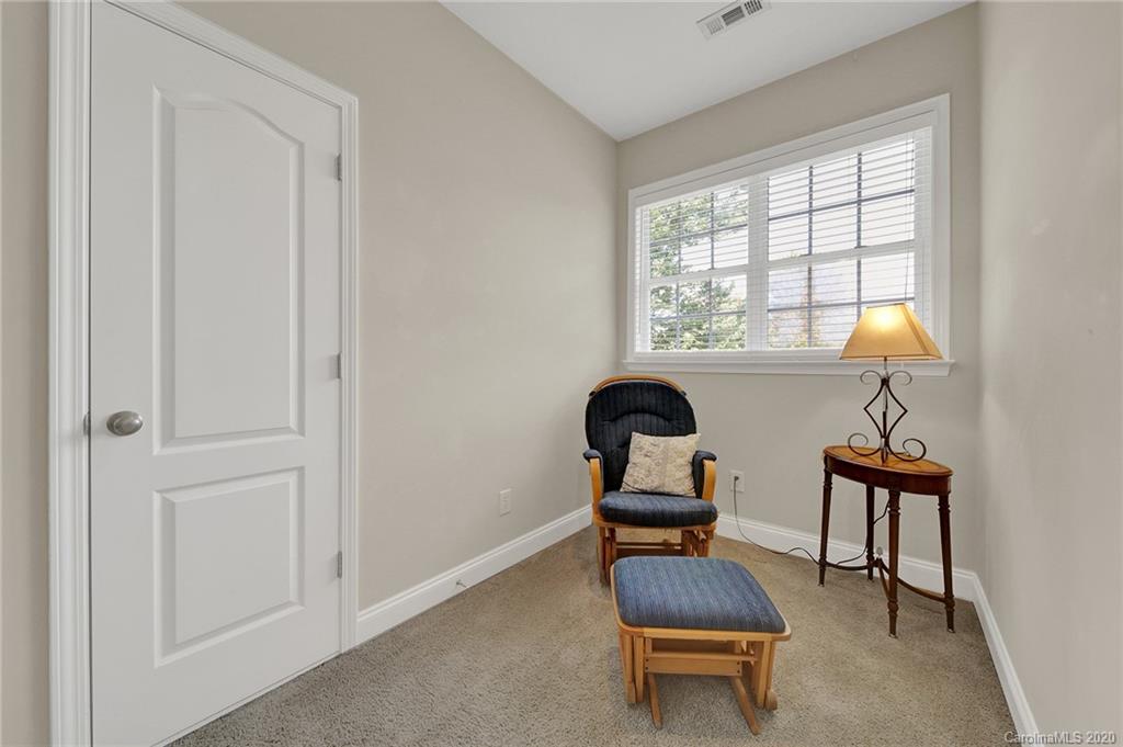 746 Quicksilver Trail Fort Mill, SC 29708 - Photo 28 of 35 a room with a chair and a window