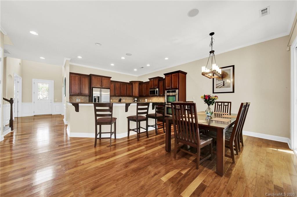 746 Quicksilver Trail Fort Mill, SC 29708 - Photo 9 of 35 a view of a dining room with furniture and wooden floor