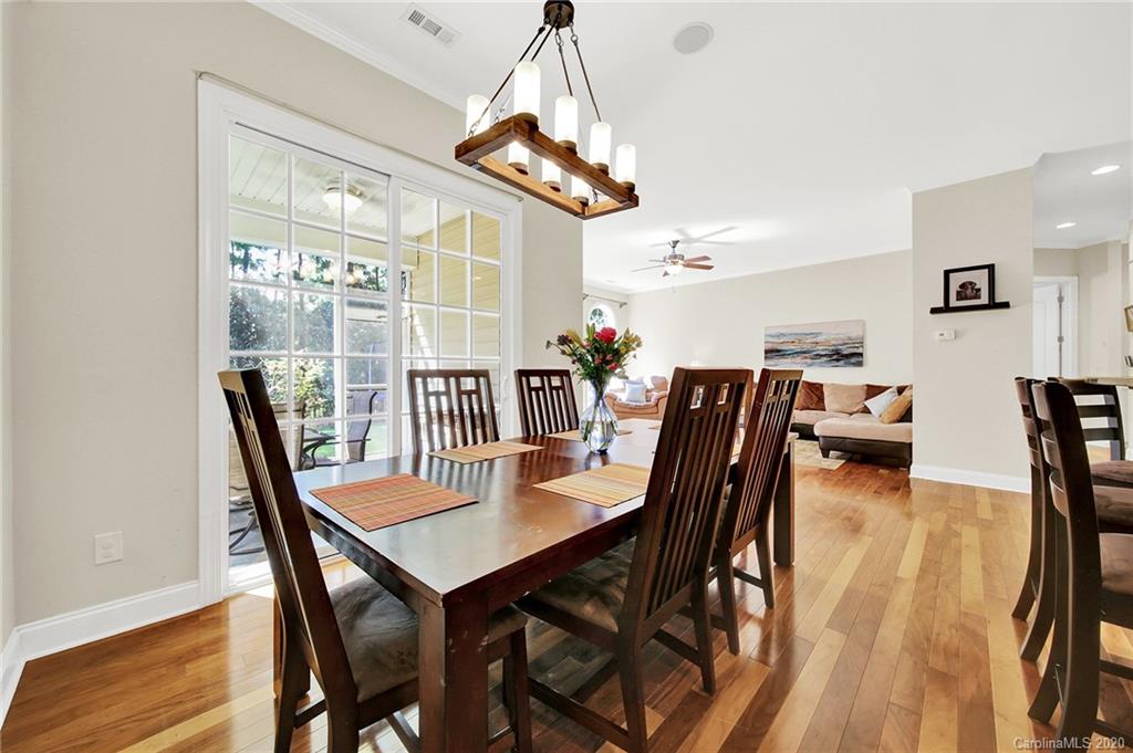 746 Quicksilver Trail Fort Mill, SC 29708 - Photo 10 of 35 a dining room with furniture a chandelier and wooden floor