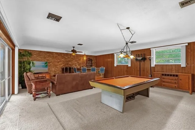 a room with furniture and air hockey table