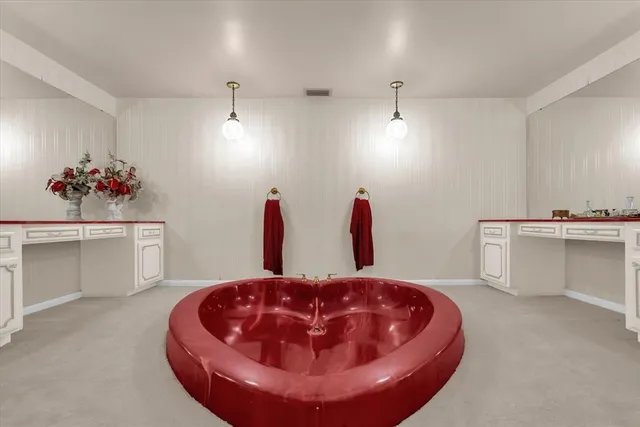 a room with a chandelier and couch