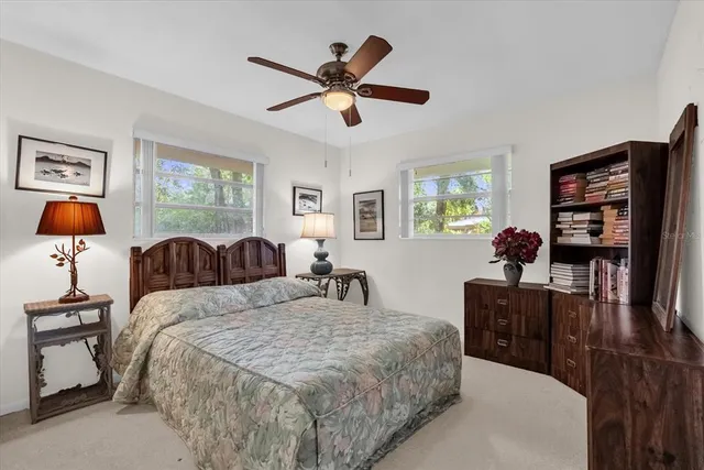 a bed room with bed and window