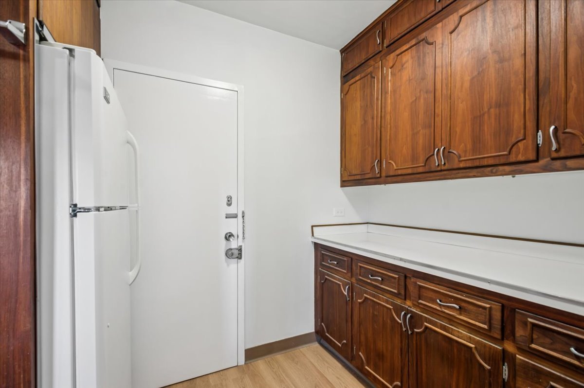 1585 Ridge Avenue, Unit 301 Evanston, IL 60201 - Photo 11 of 22 a view of a storage and utility room with wooden floor