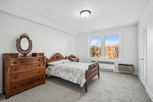 a bed room with a bed and a window