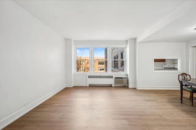 a view of livingroom with furniture window and wooden floor