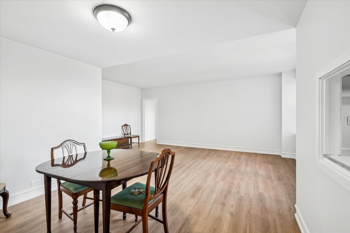 1585 Ridge Avenue, Unit 301 Evanston, IL 60201 - Photo 8 of 22 a view of a dining room with furniture and wooden floor