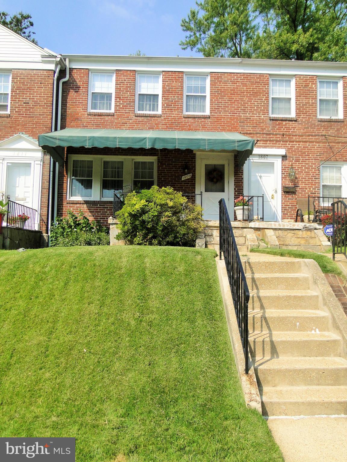 1809 Glen Ridge Road Towson, MD 21286 - Photo 1 of 30 a front view of a house with a yard