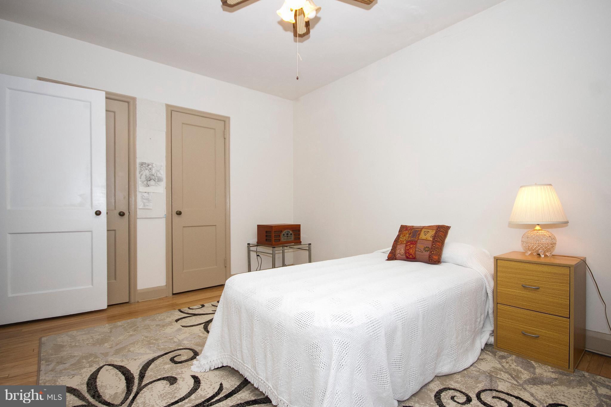 1809 Glen Ridge Road Towson, MD 21286 - Photo 20 of 30 a bedroom with a bed and a chandelier