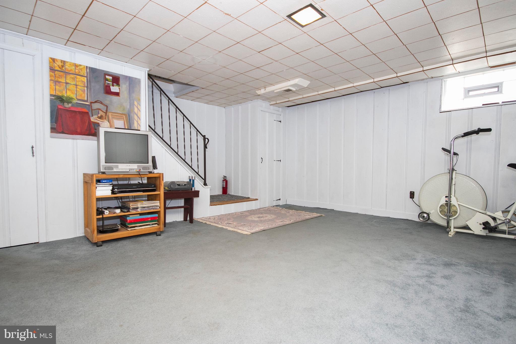 1809 Glen Ridge Road Towson, MD 21286 - Photo 24 of 30 a view of room with stairs and a couch