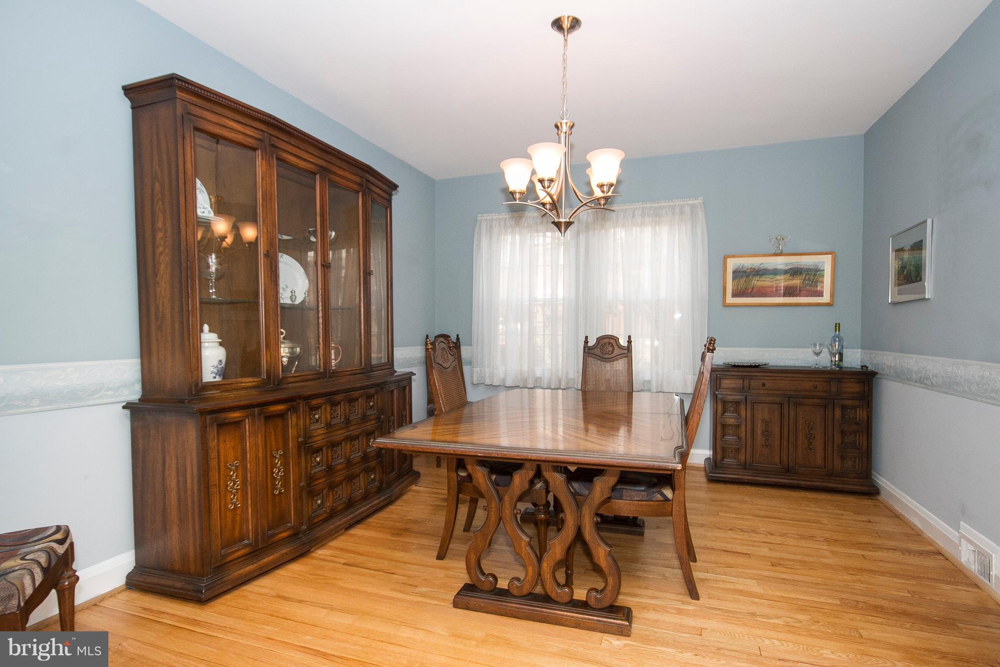 1809 Glen Ridge Road Towson, MD 21286 - Photo 6 of 30 a view of a dining room with furniture window and wooden floor