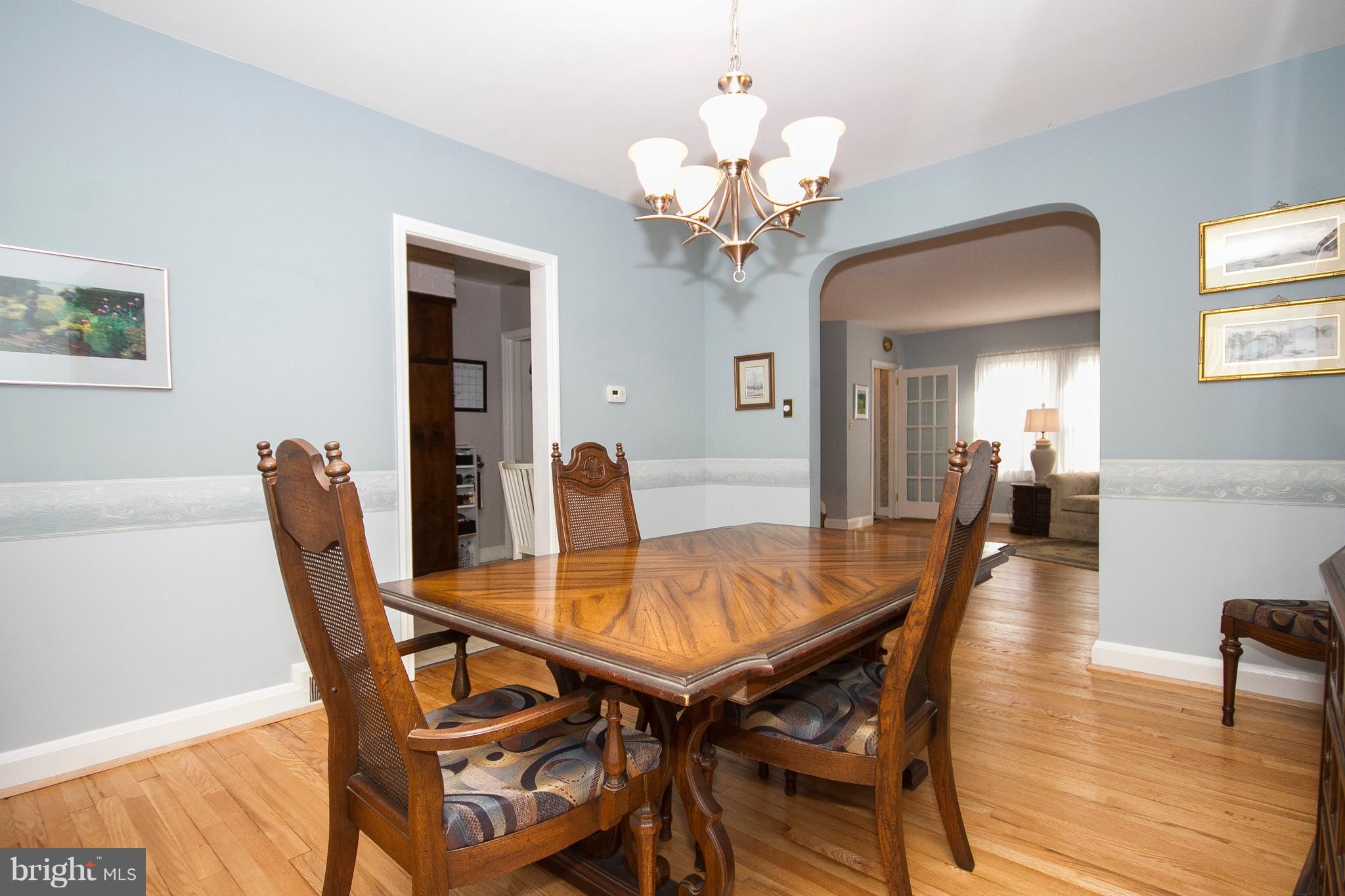 1809 Glen Ridge Road Towson, MD 21286 - Photo 7 of 30 a view of a dining room with furniture and wooden floor