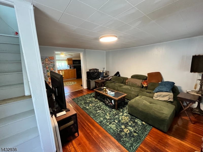 9 New Row Road, Unit A Hibernia, NJ 07842 - Photo 5 of 18 a living room with furniture rug and flat screen tv
