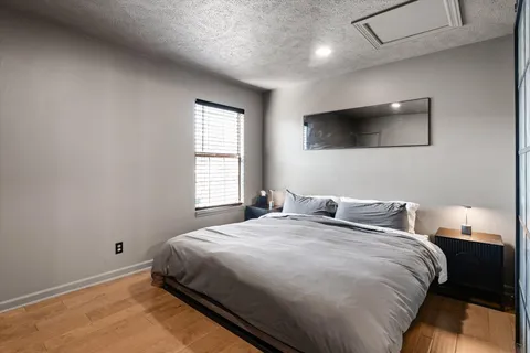 a bedroom with a bed and a walk in closet