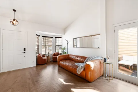 a bedroom with furniture and a window