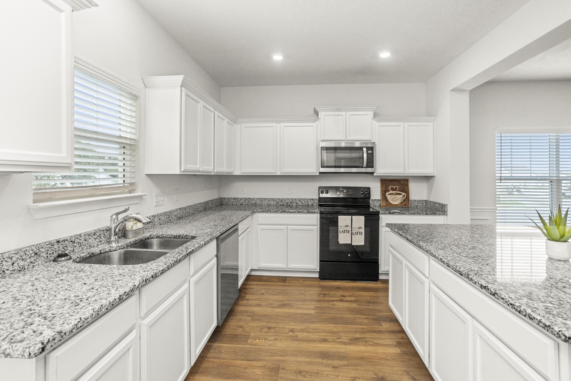 1832 Charismatic Place Murfreesboro, TN 37128 - Photo 13 of 45 a kitchen with granite countertop stainless steel appliances and white cabinets