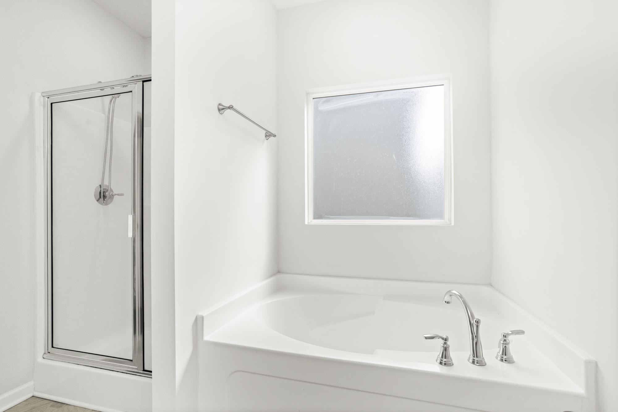 1832 Charismatic Place Murfreesboro, TN 37128 - Photo 21 of 45 a white bath tub sitting next to a shower