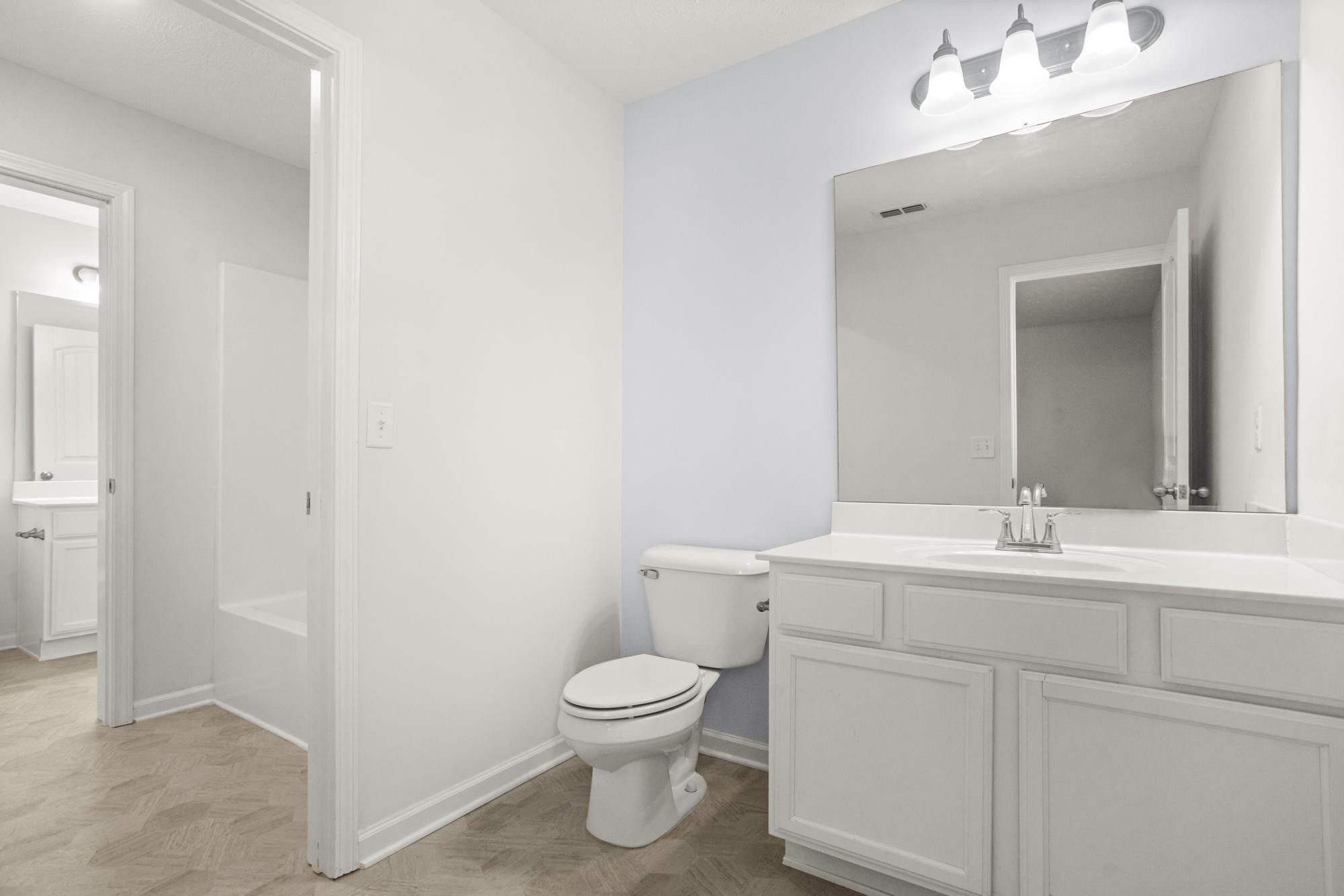 1832 Charismatic Place Murfreesboro, TN 37128 - Photo 30 of 45 a bathroom with a toilet sink and mirror