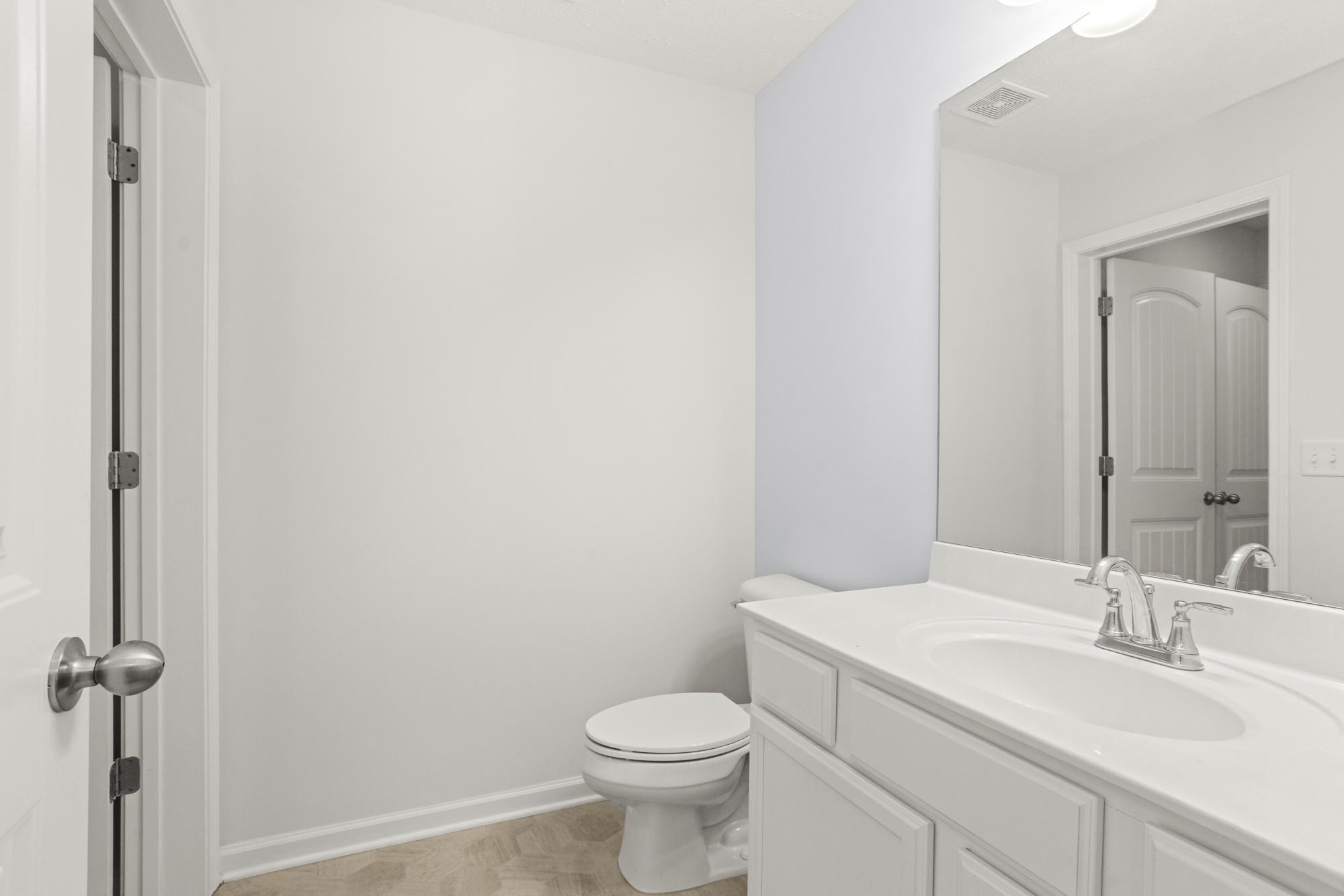 1832 Charismatic Place Murfreesboro, TN 37128 - Photo 32 of 45 a bathroom with a toilet sink vanity and mirror