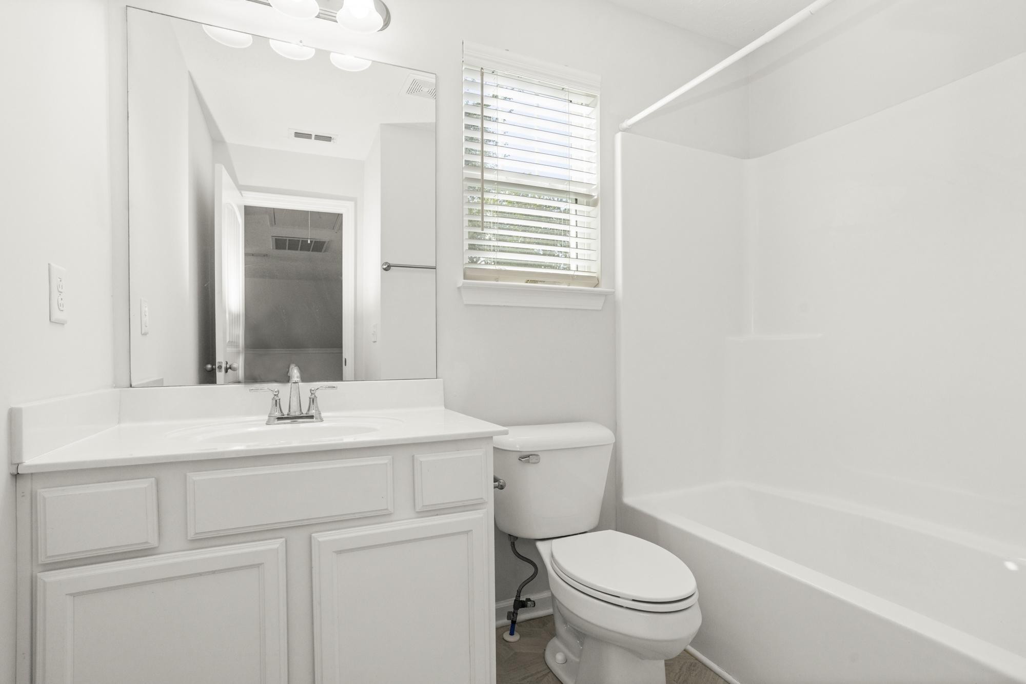 1832 Charismatic Place Murfreesboro, TN 37128 - Photo 36 of 45 a bathroom with a sink a toilet a mirror and shower