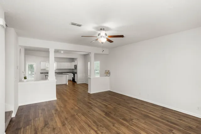a view of workspace and kitchen with sink
