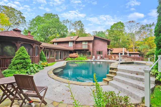 a view of a swimming pool with a patio
