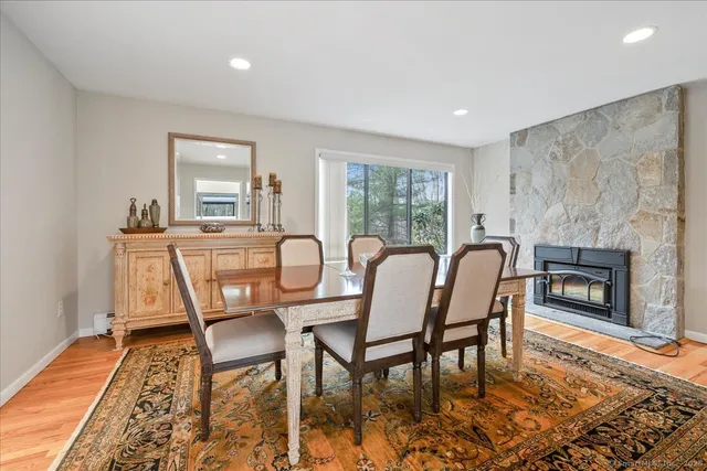 a view of a dining room with furniture window and wooden floor