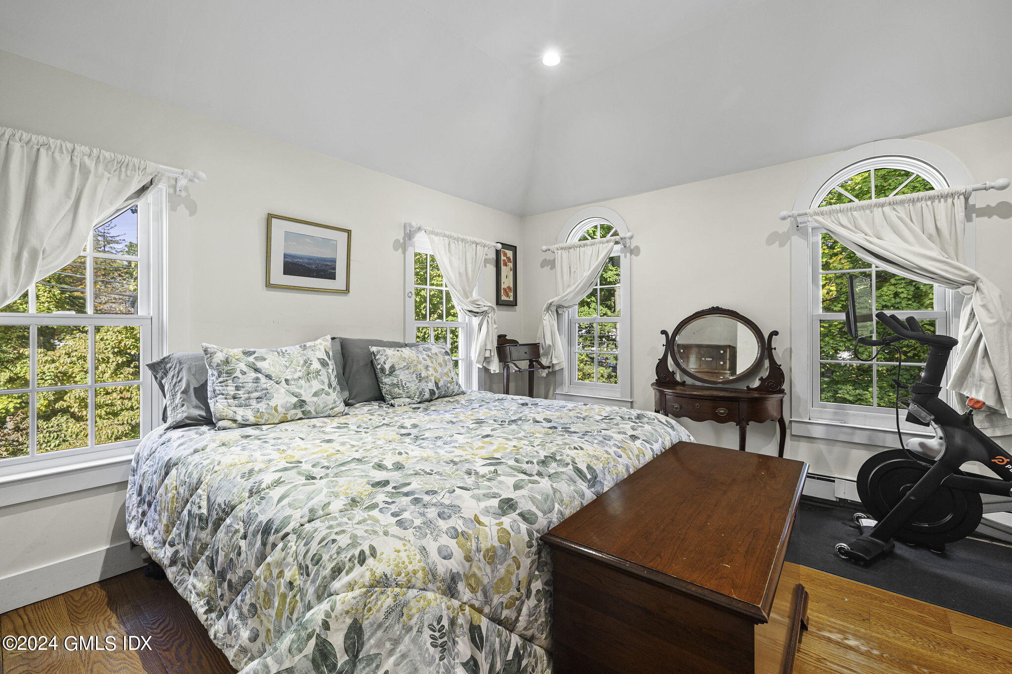 69 Riverside Avenue Riverside, CT 06878 - Photo 15 of 33 a bedroom with a bed and a dresser next to a window