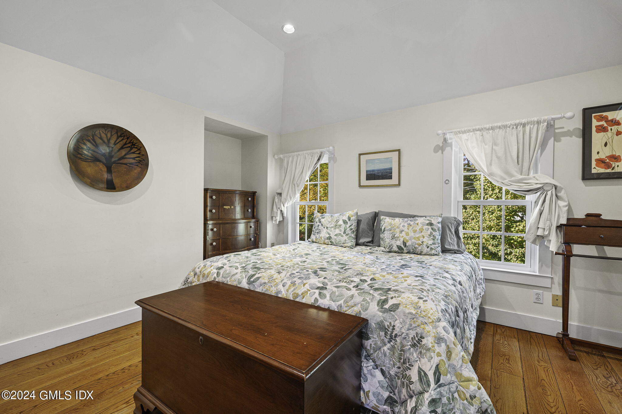 69 Riverside Avenue Riverside, CT 06878 - Photo 16 of 33 a bedroom with a bed and a flat tv screen on the dresser