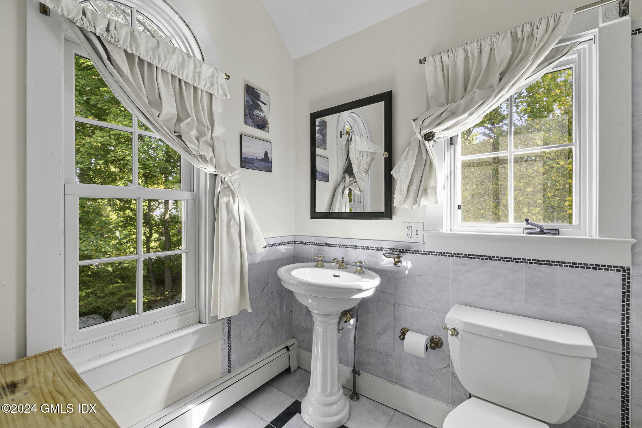 69 Riverside Avenue Riverside, CT 06878 - Photo 17 of 33 a bathroom with a toilet sink and mirror