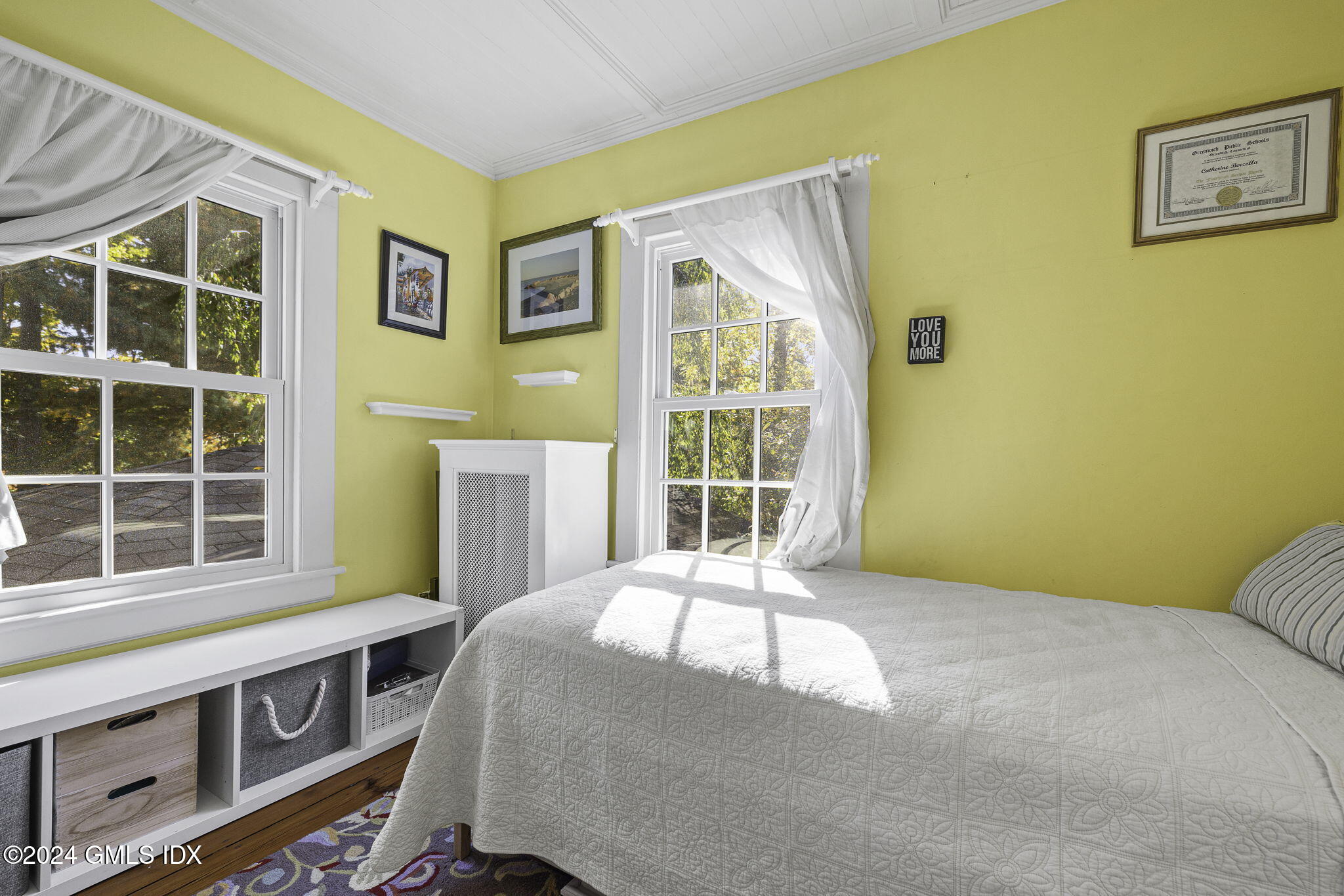 69 Riverside Avenue Riverside, CT 06878 - Photo 21 of 33 a bedroom with a bed and a window