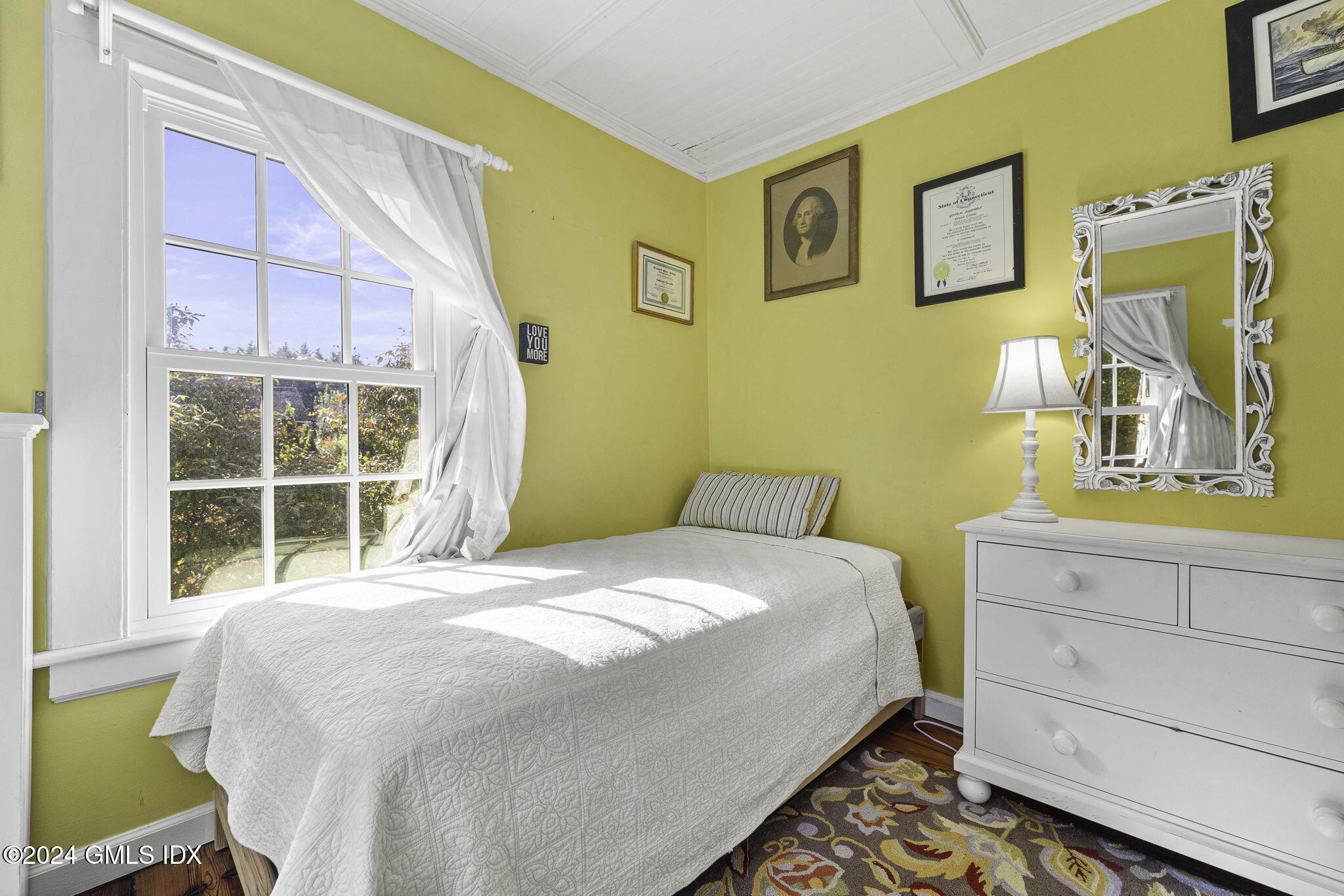 69 Riverside Avenue Riverside, CT 06878 - Photo 22 of 33 a bedroom with a bed and a window