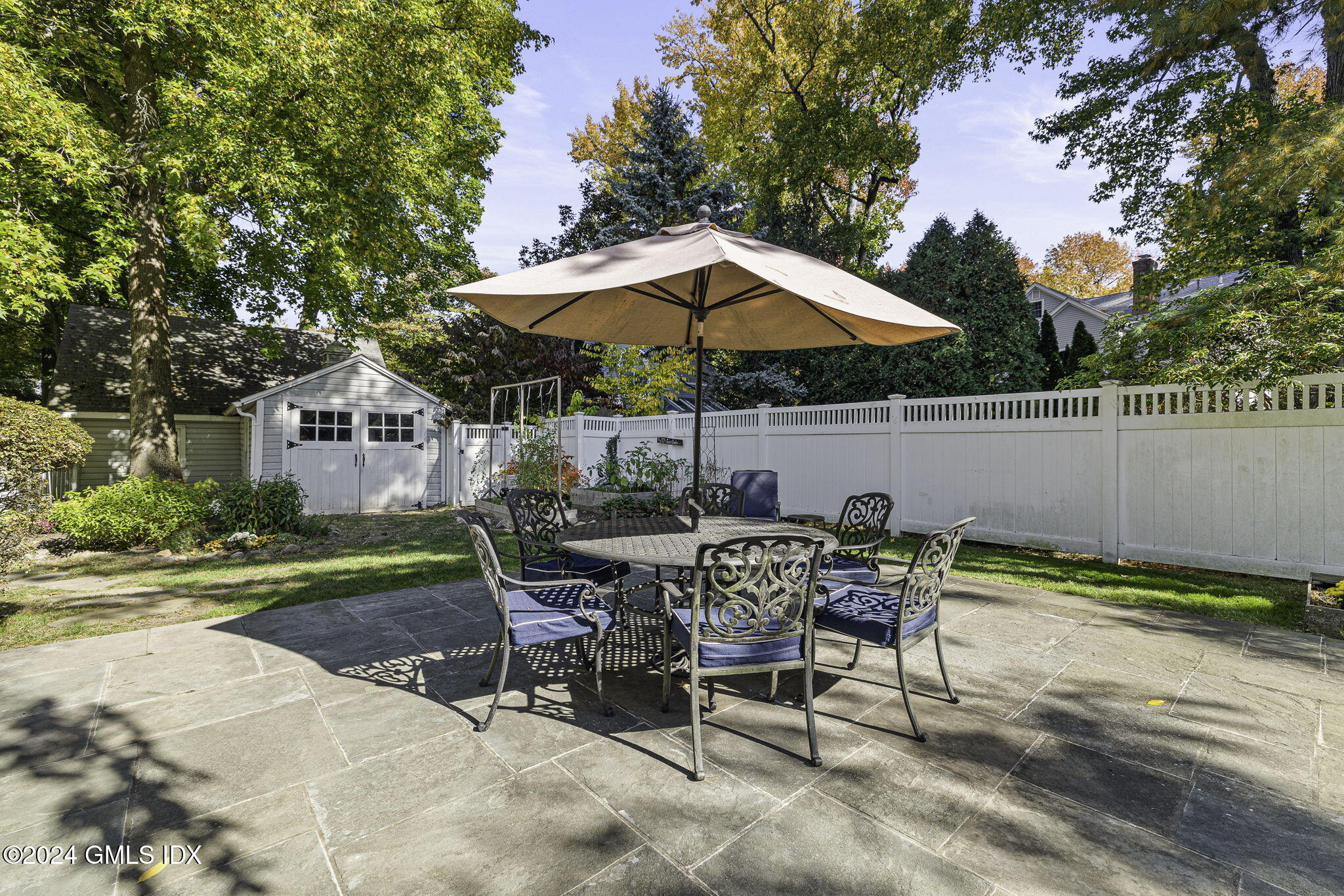 69 Riverside Avenue Riverside, CT 06878 - Photo 24 of 33 a view of backyard with seating space and trees