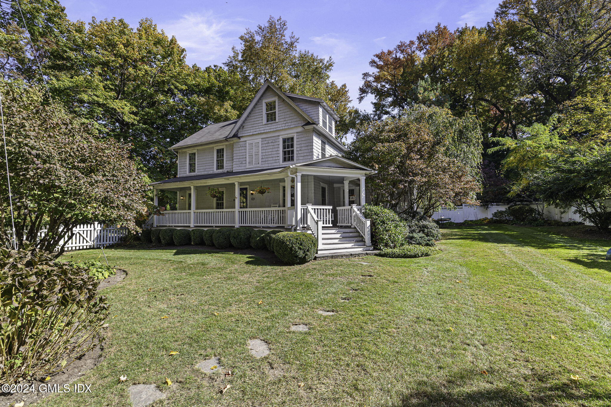 69 Riverside Avenue Riverside, CT 06878 - Photo 28 of 33 a view of a house with a yard