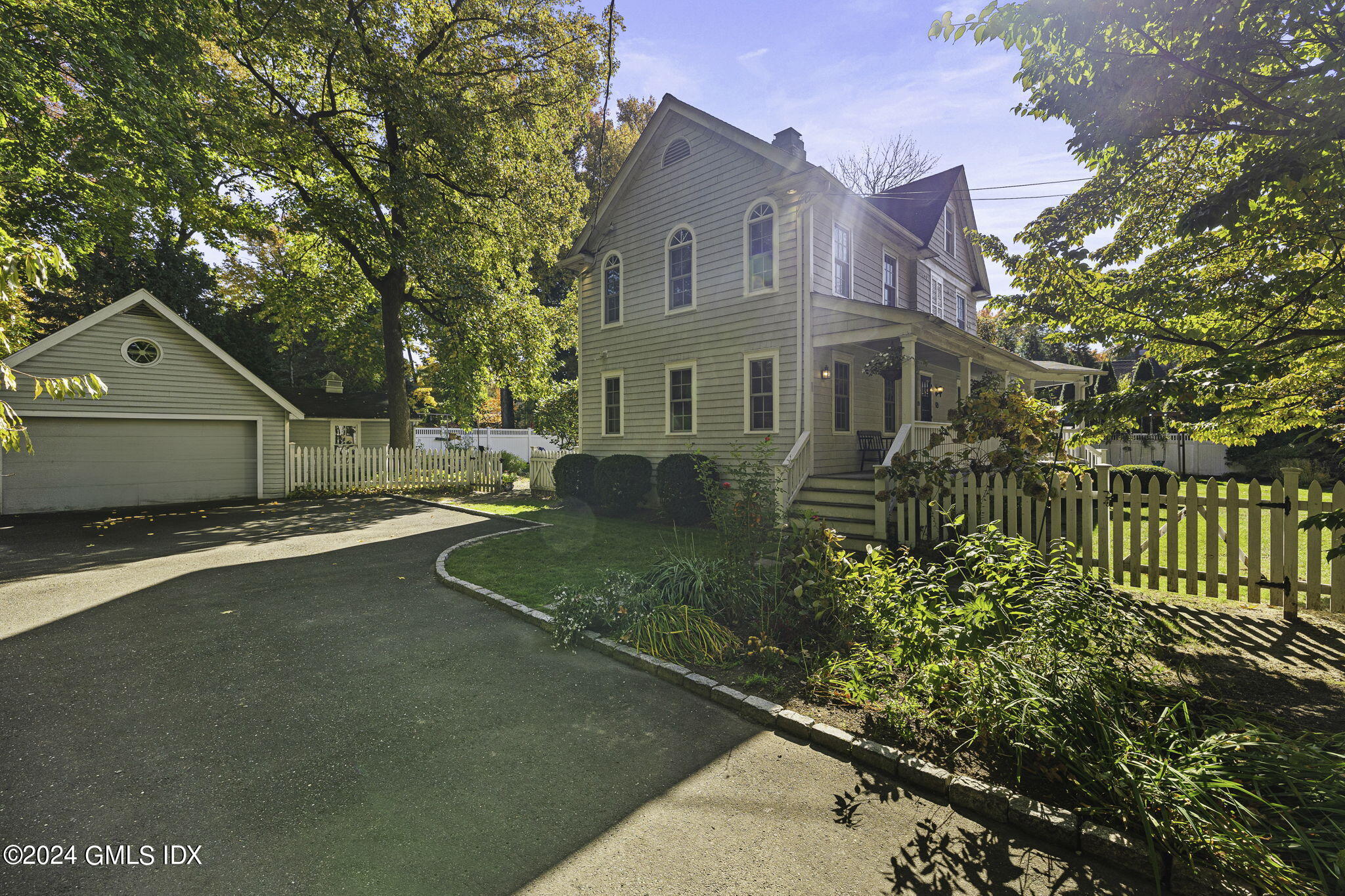 69 Riverside Avenue Riverside, CT 06878 - Photo 29 of 33 a front view of a house with garden