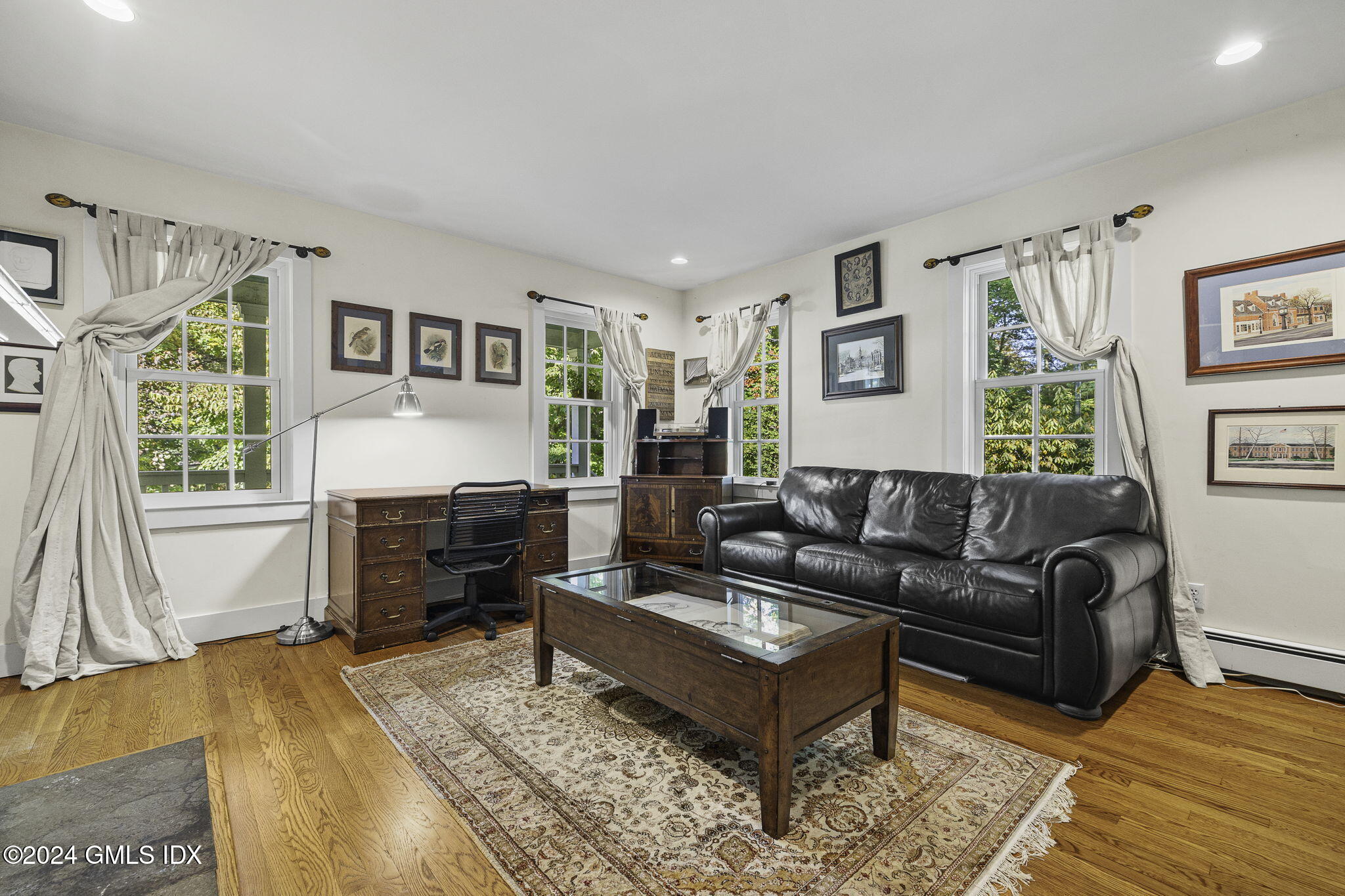 69 Riverside Avenue Riverside, CT 06878 - Photo 10 of 33 a living room with furniture and a wooden floor