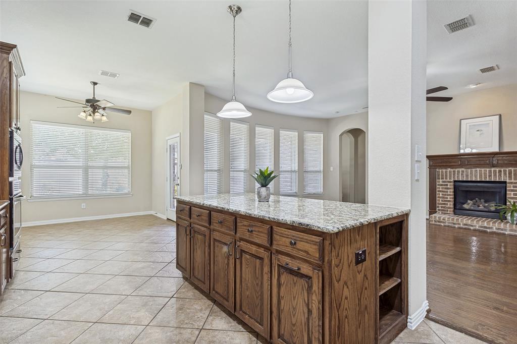 1803 Caprock Road Allen, TX 75002 - Photo 7 of 32 Kitchen overlooks living room and breakfast nook