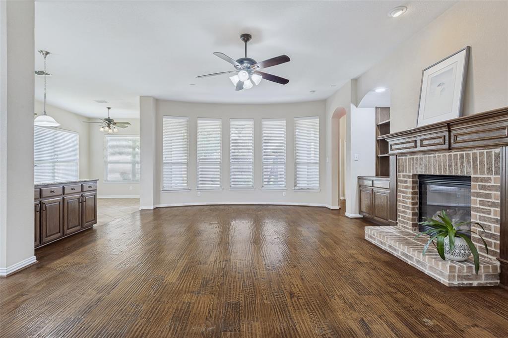 1803 Caprock Road Allen, TX 75002 - Photo 8 of 32 Living room with fireplace