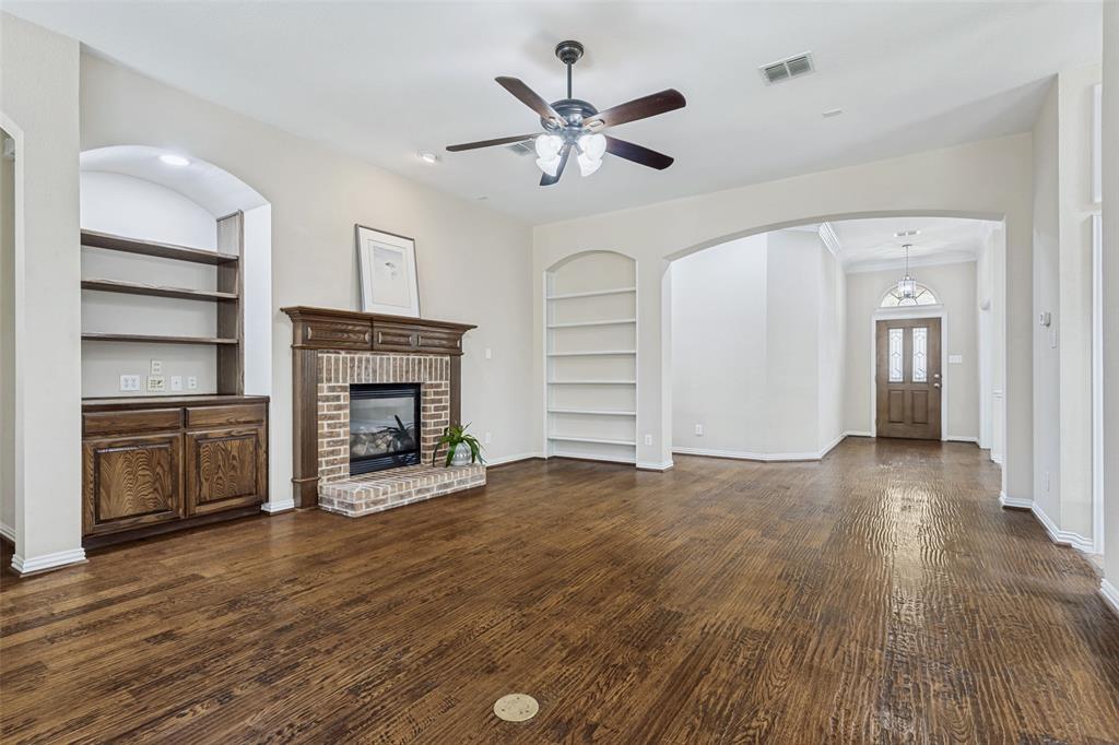 1803 Caprock Road Allen, TX 75002 - Photo 9 of 32 Living room with built-ins