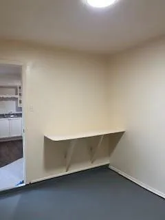 an empty room with a wooden floor