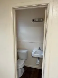 a bathroom with a toilet and a sink