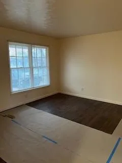 an empty room with a empty space and window