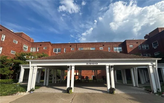 a view of building with glass windows and door