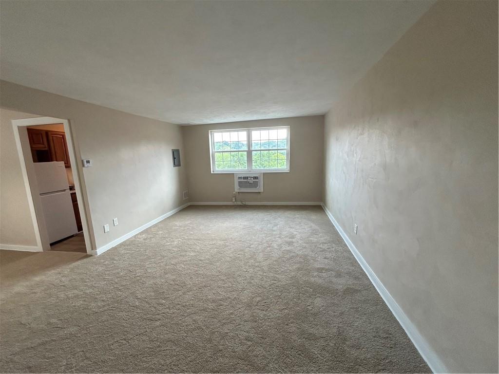 5900 Babcock Boulevard, Unit 35 Pittsburgh, PA 15237 - Photo 5 of 15 an empty room with windows